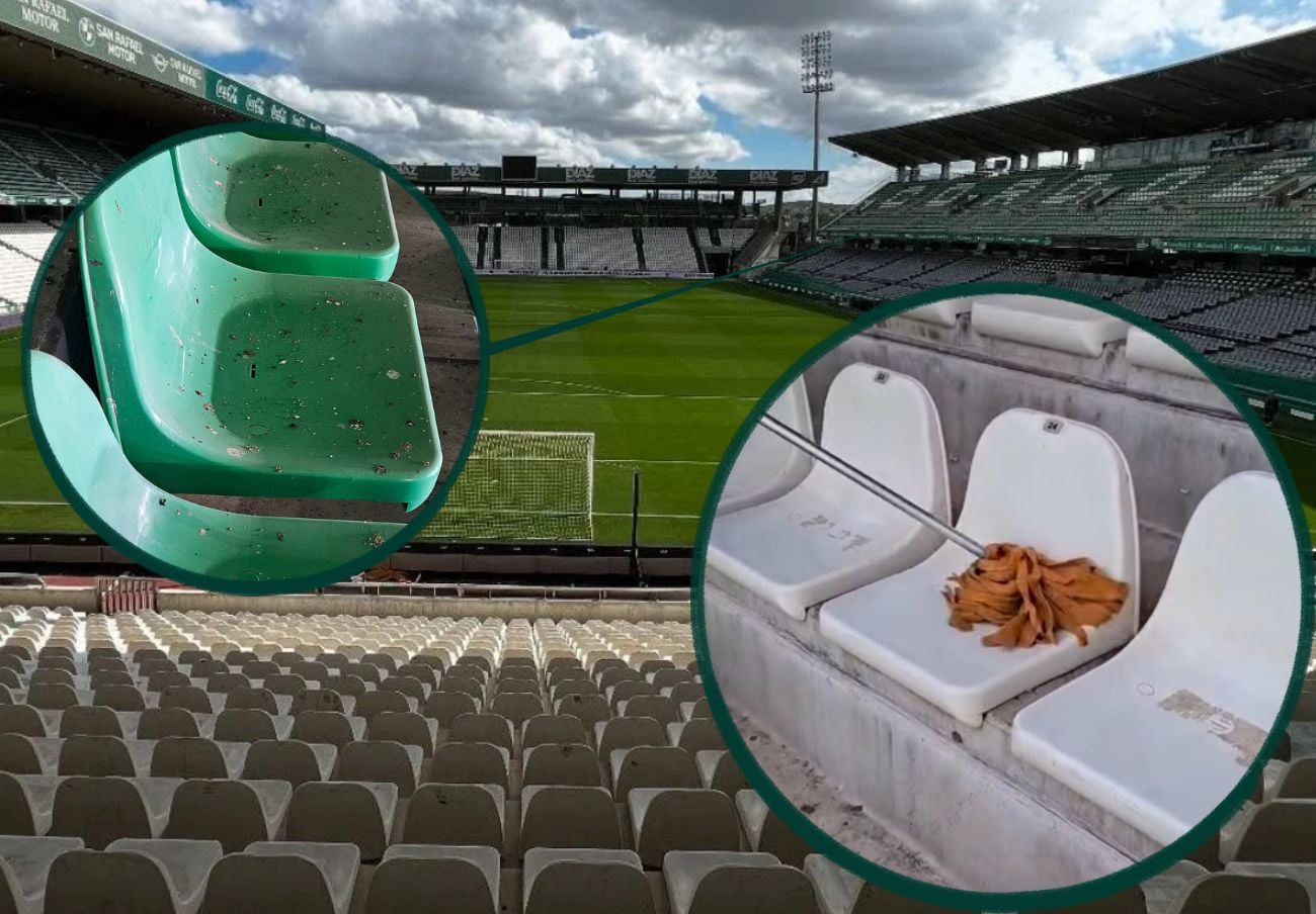 Gradas de un estadio de fútbol con asientos verdes y blancos, algunos manchados, y una fregona sobre uno blanco.